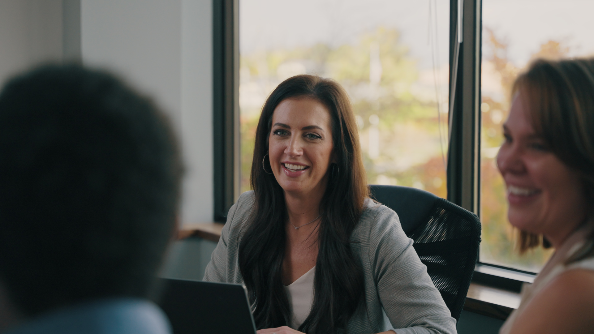 Woman smiling in conference room